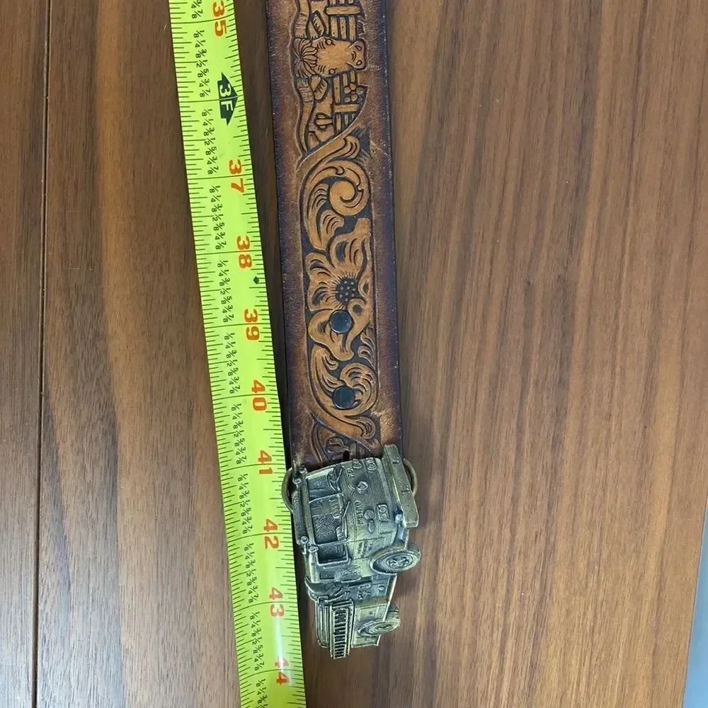 Vintage brown leather hand tooled Western belt.